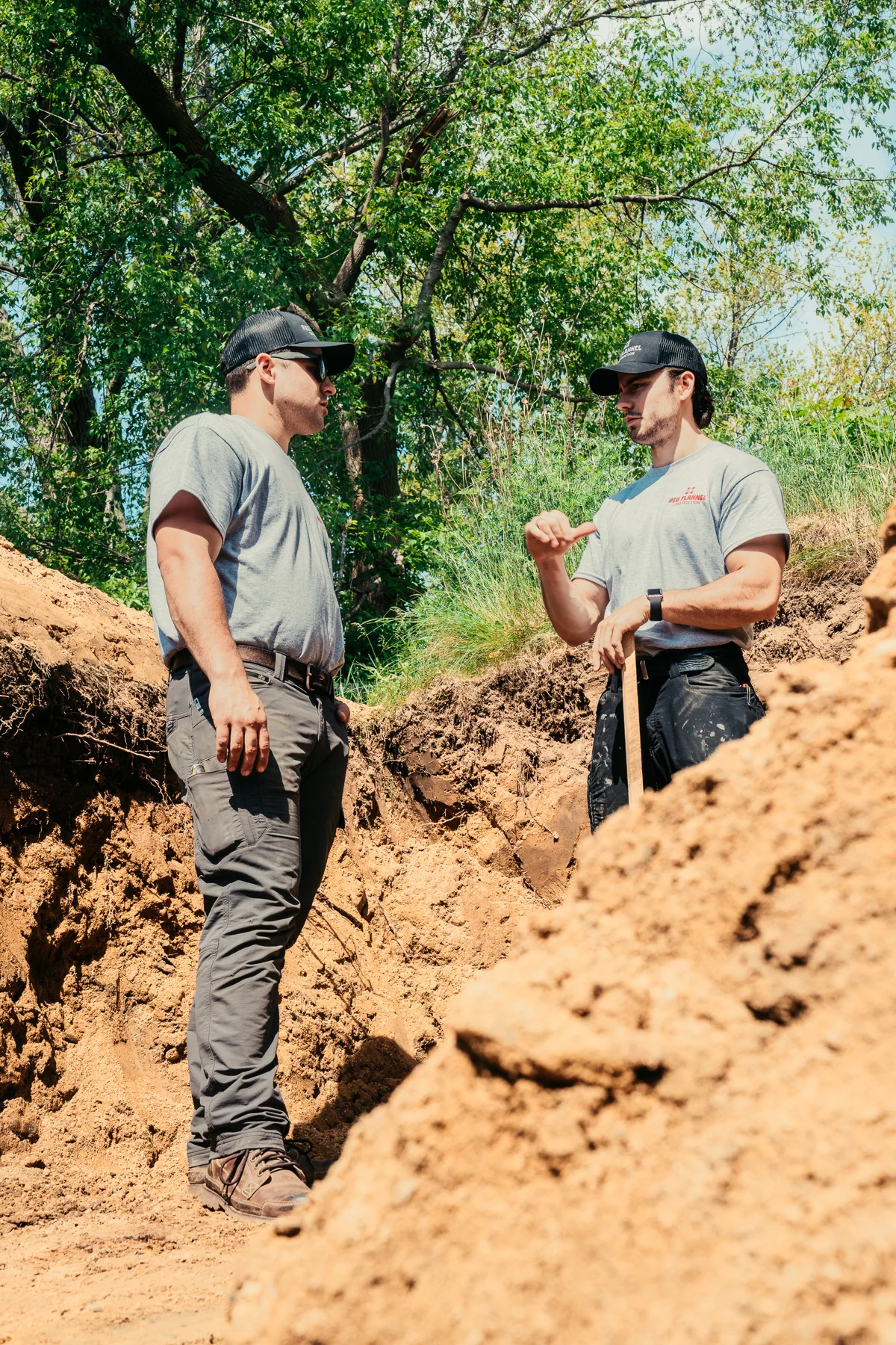 Two Red Flannel team members discussing the work on site