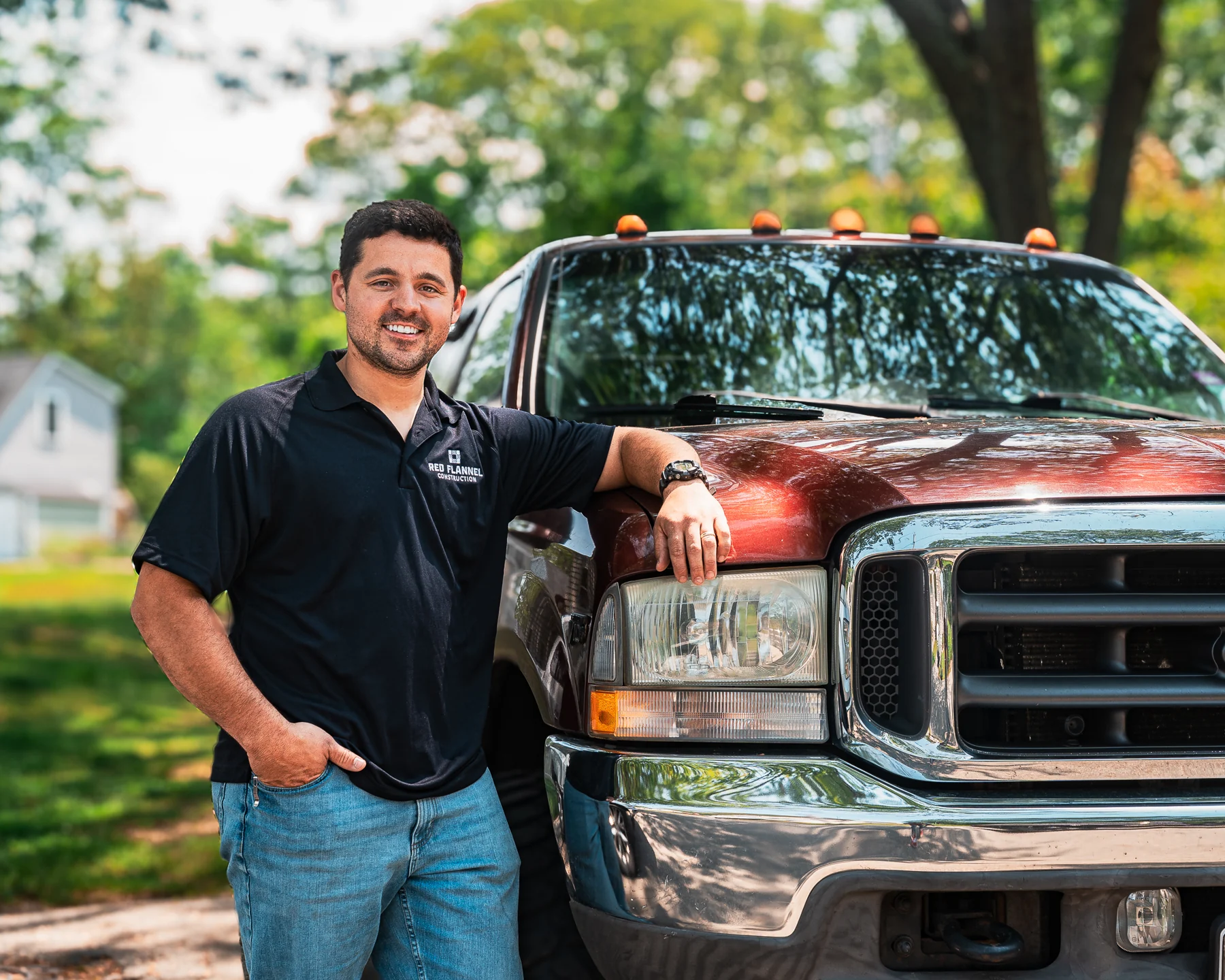 Red Flannel founder portrait beside a work truck